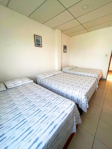 Lova arba lovos apgyvendinimo įstaigoje Pargo, habitación privada de Flor de Lis Beach House