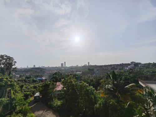 a view of a city with trees and the sky at The Reset House Mangalore in Mangalore