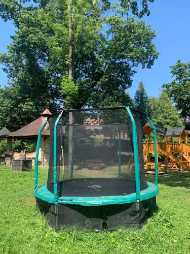 a play center in the grass in a park at Готель in Yaremche