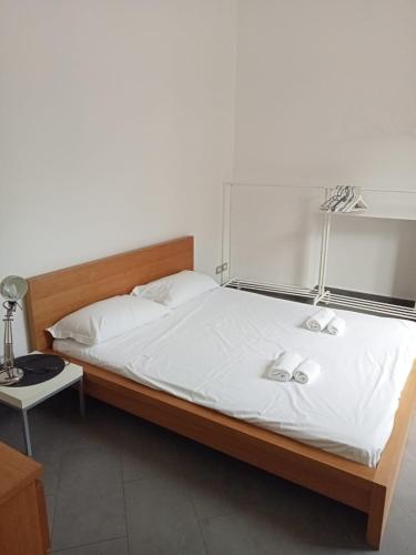 a bedroom with a bed with two towels on it at Bastioni VALE in Pescara