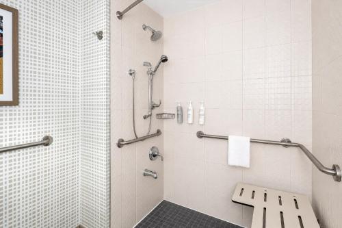 a bathroom with a shower and a toilet at Hampton Inn by Hilton Halifax Downtown in Halifax