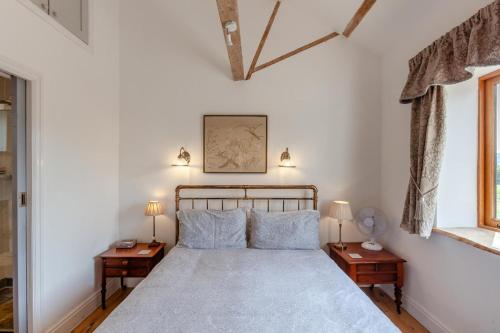 a bedroom with a large bed with two night stands at 1 Bed in Bristol oc-85559 in Langford