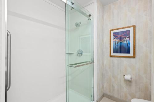 a shower with a glass door in a bathroom at Hampton Inn and Suites Swansboro Near Camp Lejeune in Swansboro