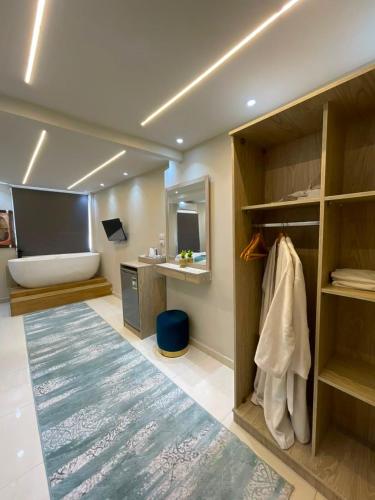 a room with a bed and a desk and a mirror at Gaillon Scarab Pyramids View in Cairo