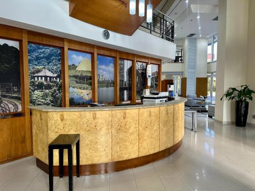a lobby with a reception counter in a building at Travel Inn Flats Santo André in Santo André
