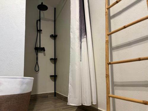 a room with a shower curtain on a wall at 7sopot in Buzet
