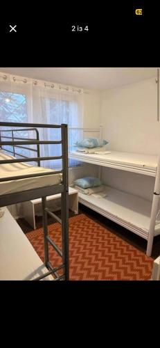 a room with two bunk beds in a room at Welcome Home in Piaseczno