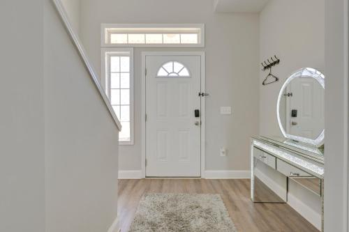 a bathroom with a white door and a mirror at Great for Groups! 2 Centrally Located Concord Gems in Concord