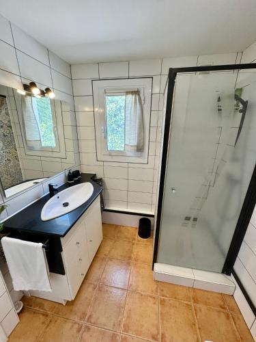 a bathroom with a sink and a shower at Casa Pont in Osséja
