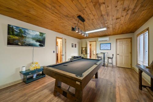 a pool table in a room with a wooden ceiling at On Beech Time in Beech Mountain