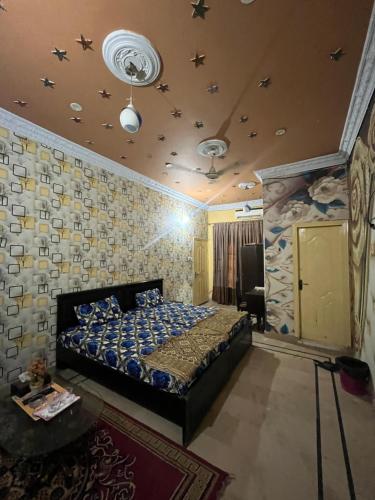 a bedroom with a bed in a room at Faran inn guest house in Hyderabad