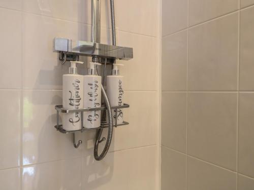 a bathroom with a group of white toothbrushes at Little Barn in Leek