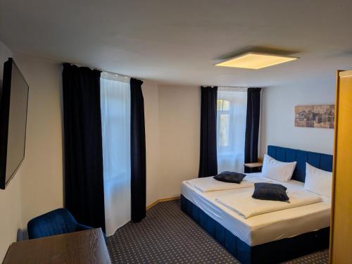 Кровать или кровати в номере Hotel in