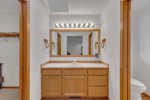 a bathroom with a sink and a mirror at Mt. St. Helens - Unit 9 in Sunriver