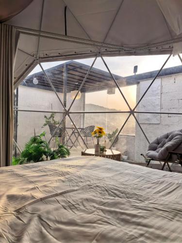 a bedroom with a bed in a tent at سكوْن in Al Baha
