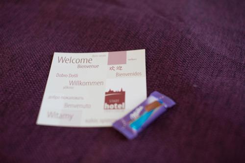 a visa card sitting on top of a purple table at Stadthotel Crailsheim in Crailsheim