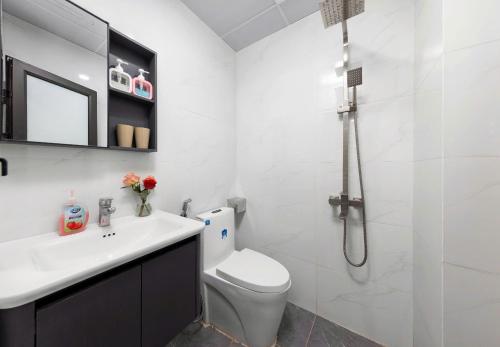 a bathroom with a toilet and a sink and a shower at LAN HA PEARL HOTEl in Cat Ba