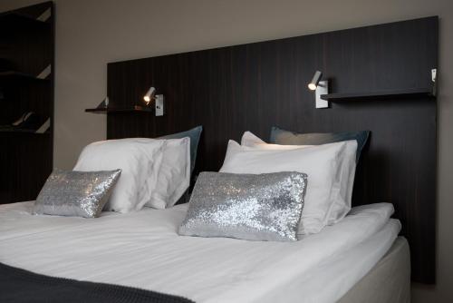 Säng eller sängar i ett rum på Hotell Fyrislund