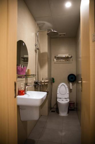 a small bathroom with a sink and a toilet at Trang An Harmony Hotel in Ninh Binh