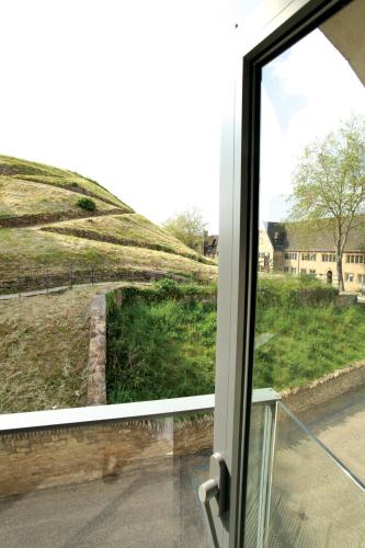 an open window with a view of a hill at Malmaison Oxford in Oxford