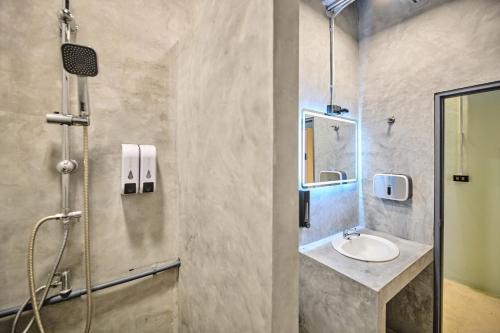 a bathroom with a sink and a shower at Noodle Shop Hostel in Nathon Bay