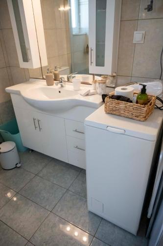 a bathroom with a sink and a mirror at Blue Deck Theologos in Theologos