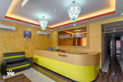 a lobby of a hotel with a reception desk at Golden Night Hotel Sunway in Petaling Jaya