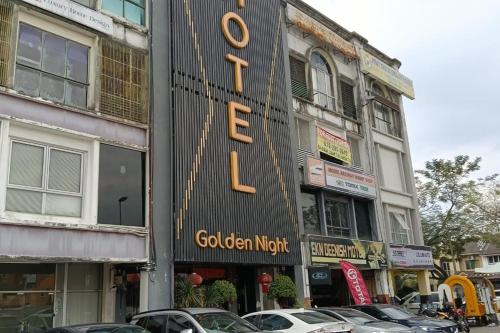 a sign for a golden night on the side of a building at Golden Night Hotel Sunway in Petaling Jaya