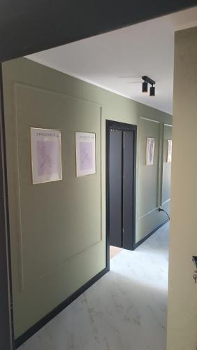a hallway with two pictures on the walls of a room at Tomberg 