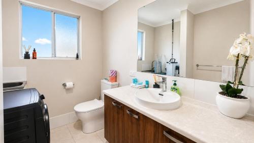 a bathroom with a sink and a toilet at Hill View Cottages - Sail B in Nannup