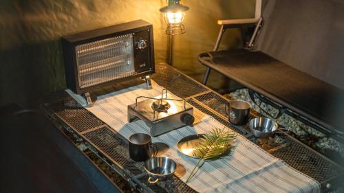 a table with pots and pans on top at Yangyang Lira Camp in Yangyang