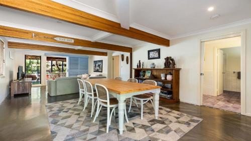 a dining room with a table and chairs at Salty Seaside in New Brighton