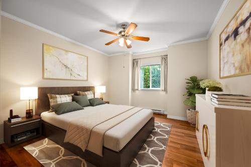 a bedroom with a bed and a ceiling fan at Sunset Paradise in Pontud
