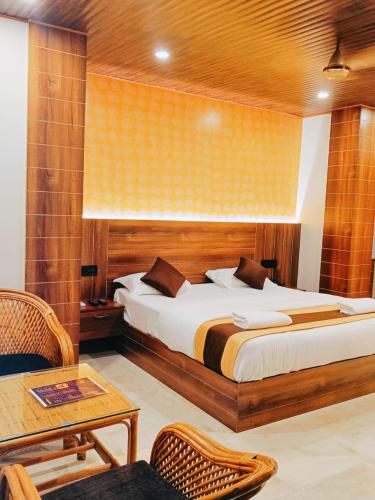 a hotel room with a bed and a table at The Mangrove Cove "200Mtrs from Beach" in Shādipur