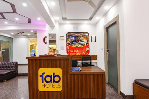 a hotel lobby with a ibid huts sign on a counter at FabHotel Lotus Star in New Delhi