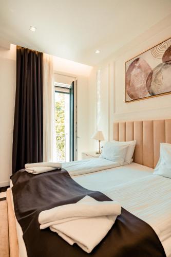 two beds sitting next to each other in a bedroom at HOTEL BALKAN in Bijeljina