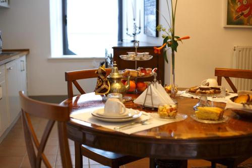 a dining room table with food on top of it at Le Rondini in Grions del Torre
