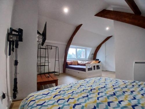 a bedroom with a bed and a large window at Studio-Cosy 17-18-19 Centre Bourbourg in Bourbourg