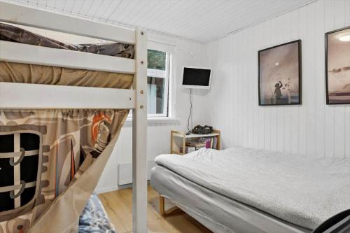 a bedroom with a bunk bed next to a window at LF16124-Farso-Bjarkesvej-4 in Farsø