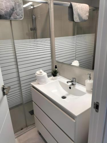 a bathroom with a sink and a mirror at Marys Place in Costa Del Silencio