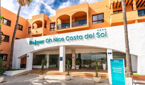 a building with a sign that reads below on nice costello del sol at Bakour Oh Nice Costa del Sol in Estepona