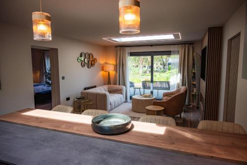 a living room with a table with a bowl on it at Retreat 1 in Beccles