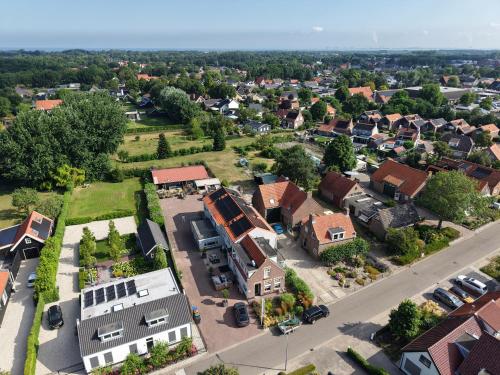 an aerial view of a small town with houses at Guesthouse Ouddorp Connection in Ouddorp