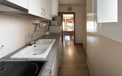 a kitchen with a sink and a counter top at Miquel 2 – Apartamento con Parking, Wifi y A/C in Tossa de Mar