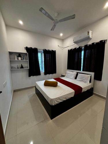 a bedroom with a large bed in a room at Villa Stay in Pondicherry
