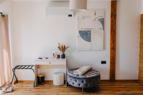a room with a desk and a stool next to a table at Novak Home - Luxury villa with indoor pool & sauna in Štrigova