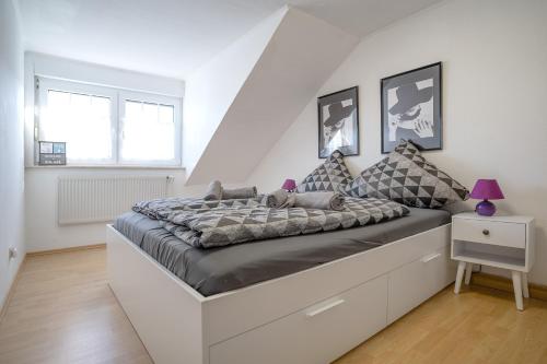 a bedroom with a large bed in a room at Haus Biene am Meer in Norden