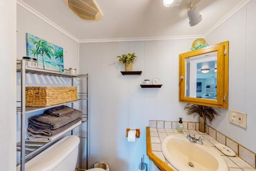 a bathroom with a sink and a mirror at Montego Bay - Ocean 13336 in Ocean City