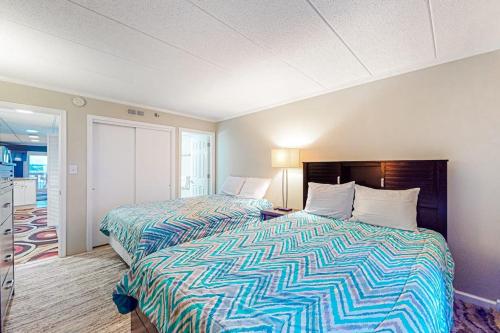 a hotel room with two beds in a room at White Marlin 303B in Ocean City