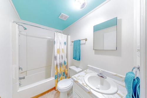a bathroom with a sink and a toilet and a shower at The Sea Captain's Sanctuary in Ocean City